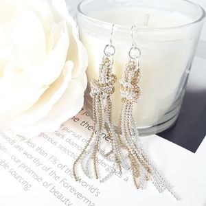 Gold and silver knotted earrings